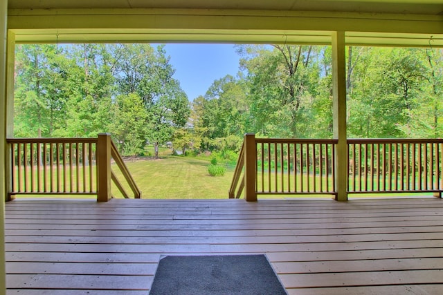 wooden terrace with a yard