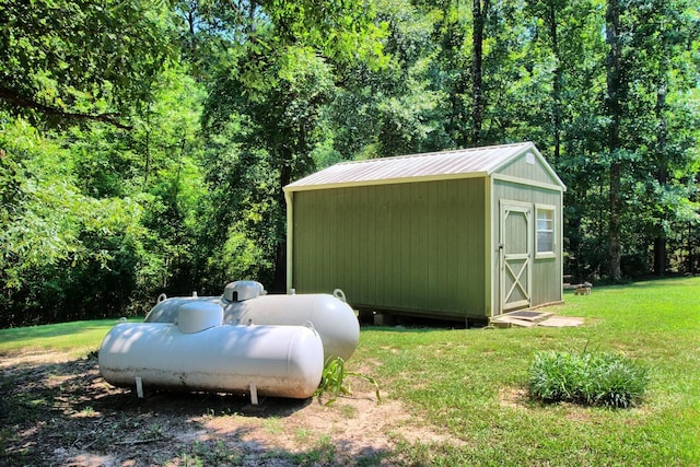 view of outbuilding featuring a yard