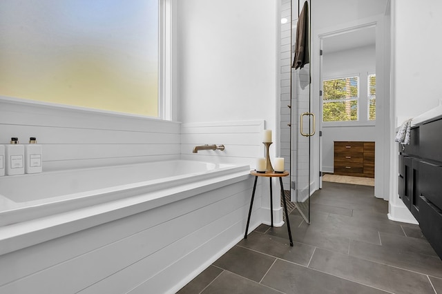 150 Tatanka Trl, Brookeland, TX 75931 - bathroom with a bath, a shower stall, and tile patterned flooring
