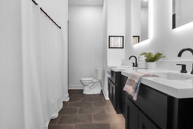 150 Tatanka Trl, Brookeland, TX 75931 - bathroom featuring toilet, double vanity, tile patterned floors, a shower with curtain, and baseboards