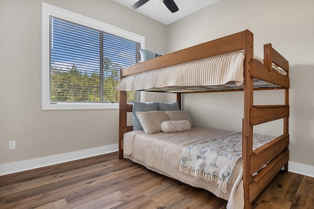 150 Tatanka Trl, Brookeland, TX 75931 - bedroom with wood finished floors, baseboards, and a ceiling fan