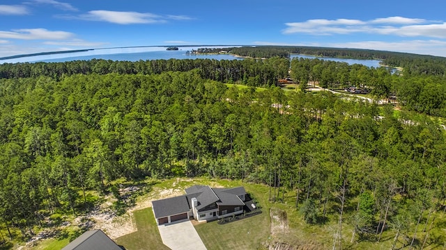 150 Tatanka Trl, Brookeland, TX 75931 - drone / aerial view of a heavily wooded area and a nearby body of water