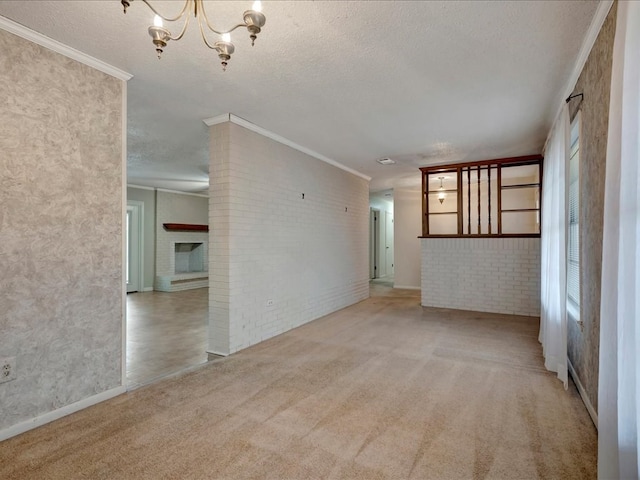 unfurnished room with a textured ceiling, carpet floors, and a healthy amount of sunlight