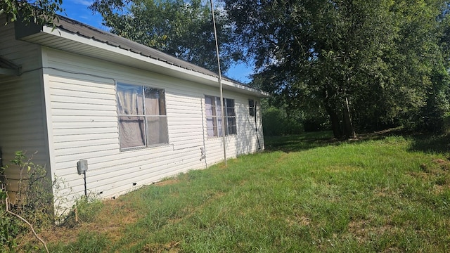 view of property exterior featuring a yard