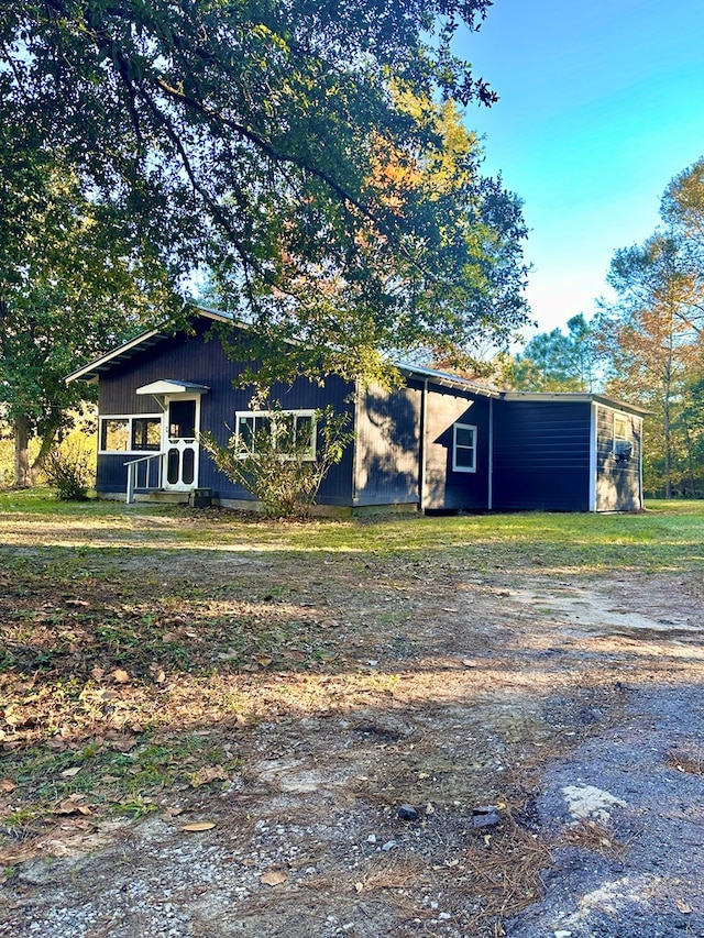 206 Perkins St, Zavalla, TX 75980 - view of front of house featuring an outbuilding
