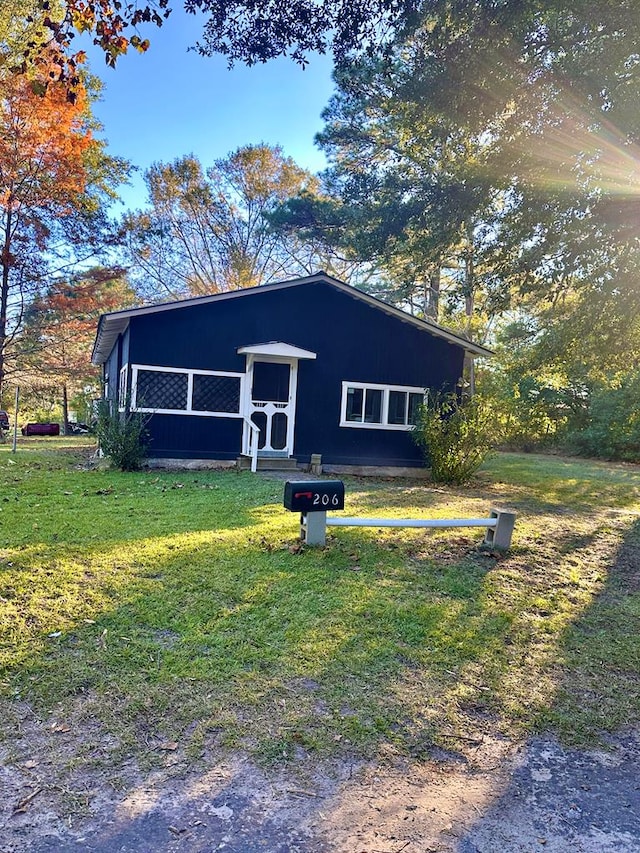 206 Perkins St, Zavalla, TX 75980 - view of front of house with a front yard