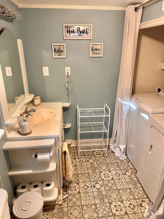 206 Perkins St, Zavalla, TX 75980 - bathroom with washer and dryer, vanity, and ornamental molding
