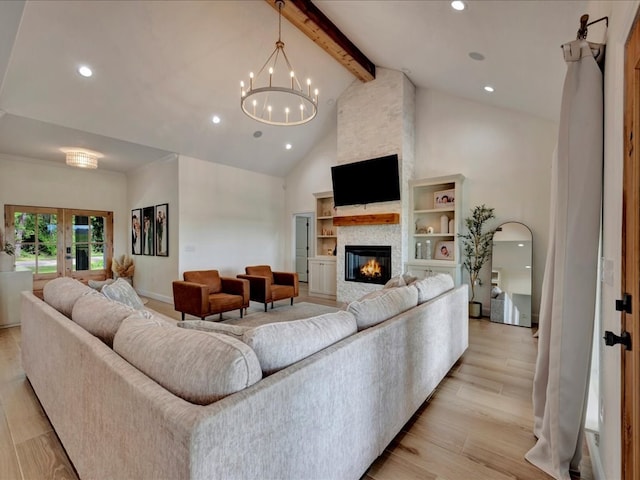 living room featuring high vaulted ceiling, an inviting chandelier, a stone fireplace, beamed ceiling, and light hardwood / wood-style floors