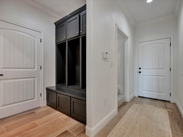 mudroom featuring crown molding