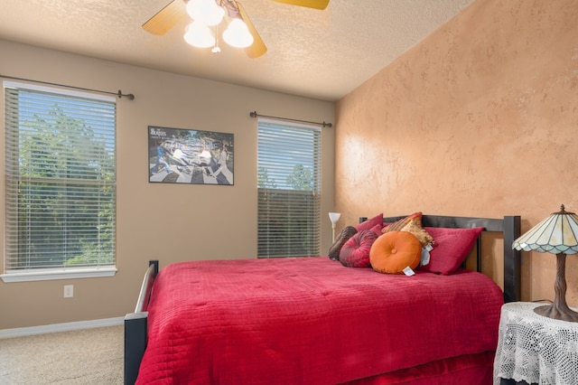 474 Mountain View Rd, Lufkin, TX 74904 - bedroom with a textured ceiling, carpet floors, a textured wall, baseboards, and ceiling fan