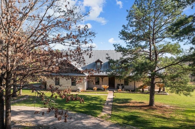 474 Mountain View Rd, Lufkin, TX 74904 - view of front facade with a front yard and metal roof