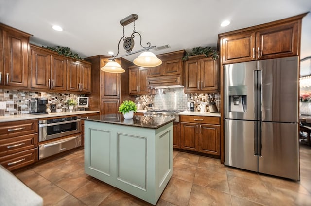 kitchen with stainless steel appliances, recessed lighting, backsplash, visible vents, and a warming drawer