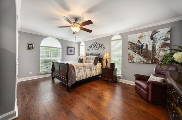bedroom featuring crown molding, baseboards, and hardwood / wood-style flooring