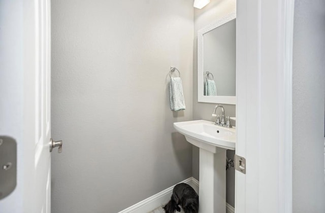bathroom featuring baseboards