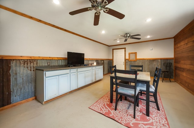 dining area with a wainscoted wall, a ceiling fan, recessed lighting, finished concrete floors, and ornamental molding