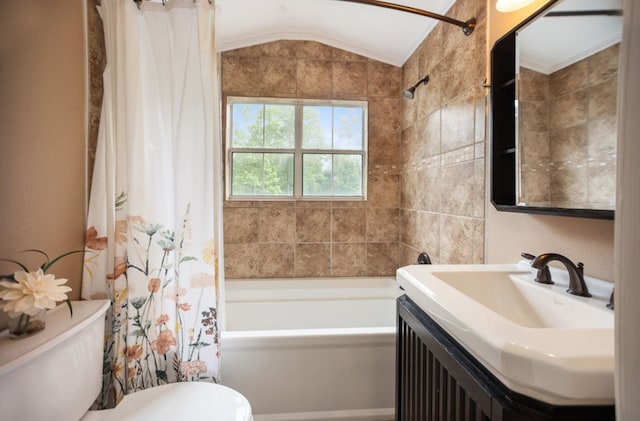 full bathroom featuring toilet, lofted ceiling, shower / bath combo, and vanity
