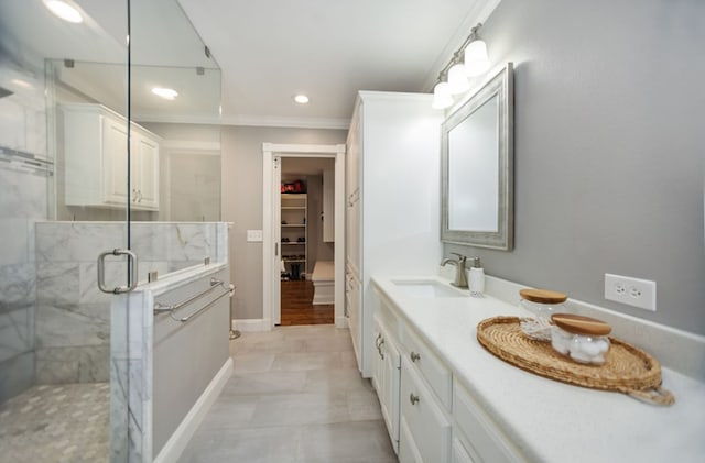 full bath featuring crown molding, a stall shower, vanity, a spacious closet, and recessed lighting