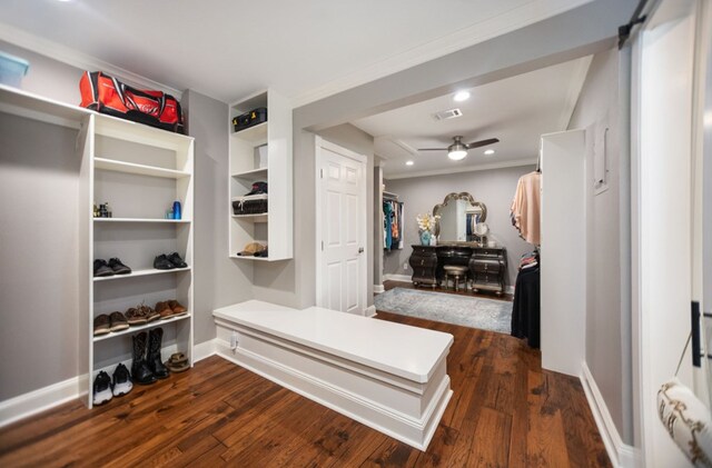 mudroom featuring visible vents, ornamental molding, baseboards, dark wood-style floors, and a ceiling fan
