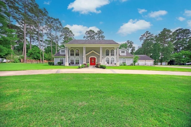 neoclassical / greek revival house with a front lawn