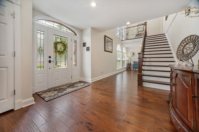 entrance foyer featuring recessed lighting, baseboards, stairway, and hardwood / wood-style floors