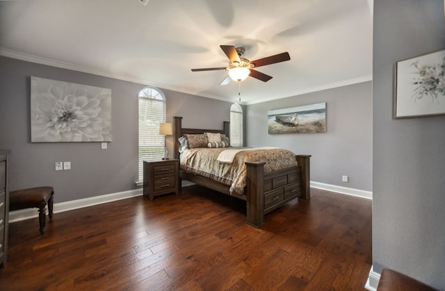 bedroom featuring baseboards, ornamental molding, dark wood-type flooring, and a ceiling fan