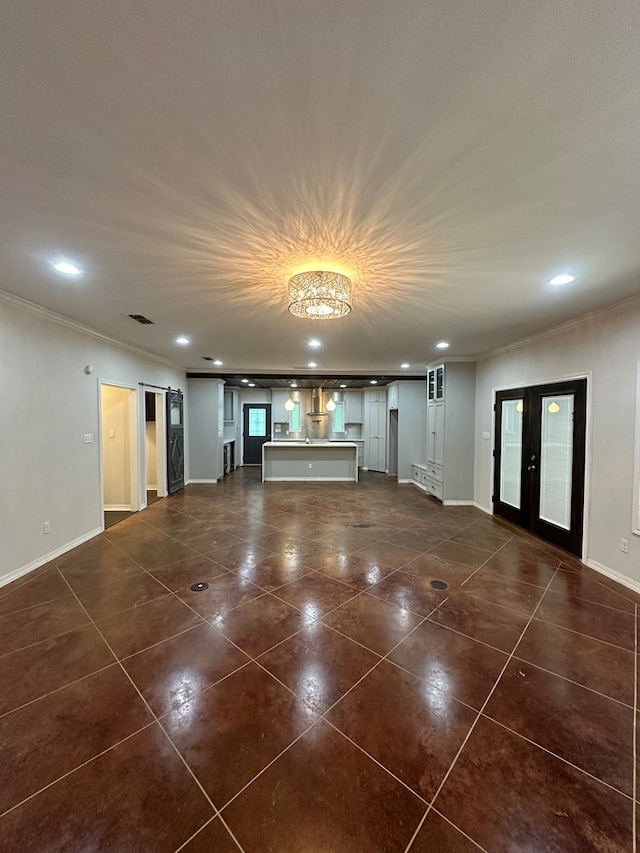 6197 State Highway 147, Center, TX 75935 - unfurnished living room featuring ornamental molding, dark tile patterned flooring, recessed lighting, and french doors