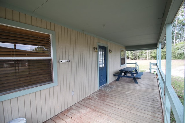 wooden terrace with a porch