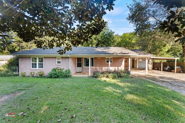 single story home featuring a front yard and a carport