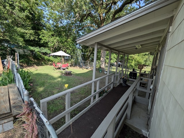 663 Mount Carmel Rd, Lufkin, TX 75904 - wooden terrace with an outdoor fire pit