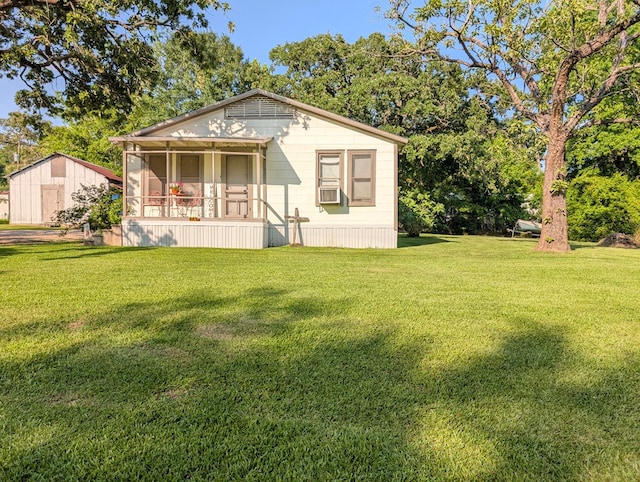 663 Mount Carmel Rd, Lufkin, TX 75904 - view of front of home with a front lawn and cooling unit