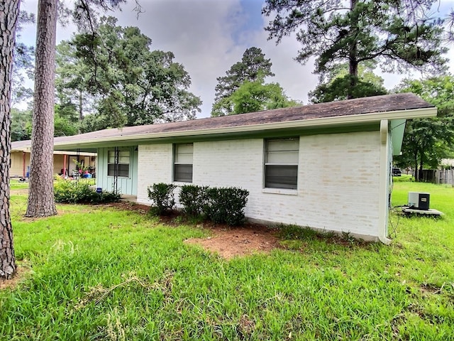 view of property exterior featuring a yard