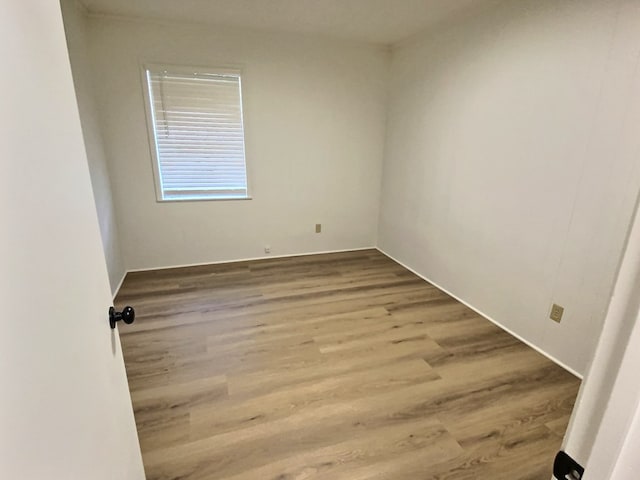 unfurnished room featuring hardwood / wood-style floors