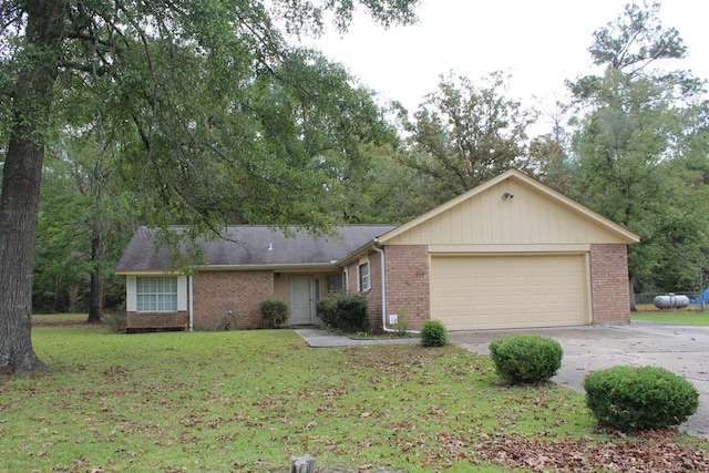 ranch-style home with a garage and a front yard