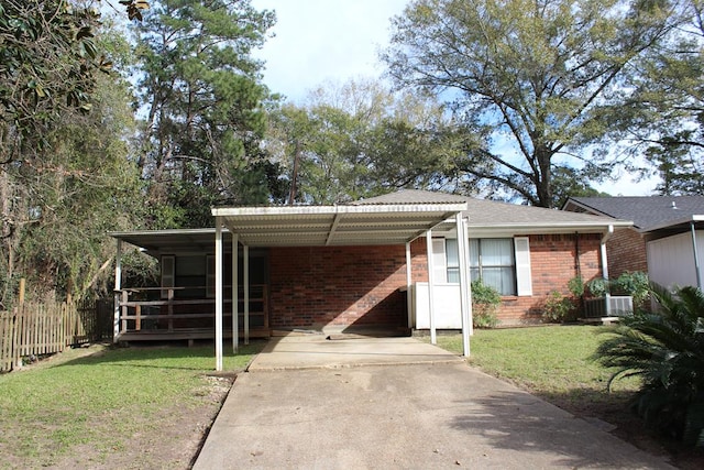 view of front of house featuring a front yard, central AC, and a carport