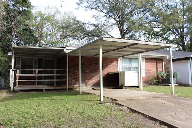 rear view of house featuring a yard