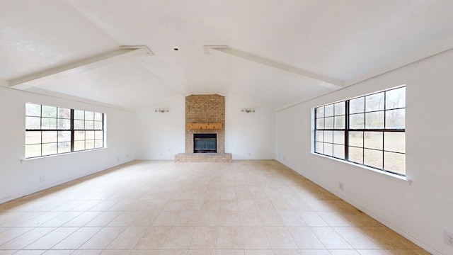 unfurnished living room featuring vaulted ceiling with beams, light tile patterned flooring, and a fireplace