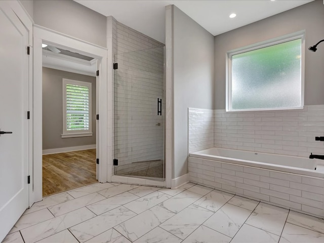 829 Village Gate Cir, Nacogdoches, TX 75961 - bathroom with marble finish floors, a bath, a shower stall, and baseboards