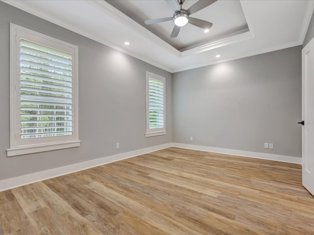 829 Village Gate Cir, Nacogdoches, TX 75961 - unfurnished room featuring ornamental molding, a tray ceiling, light wood-style floors, ceiling fan, and baseboards