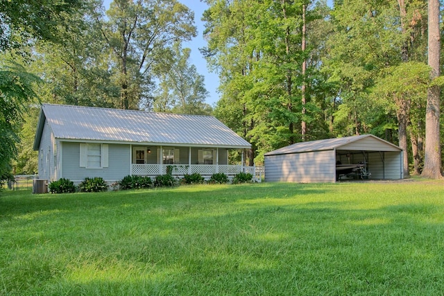 view of front of property with a front lawn, a carport, and cooling unit