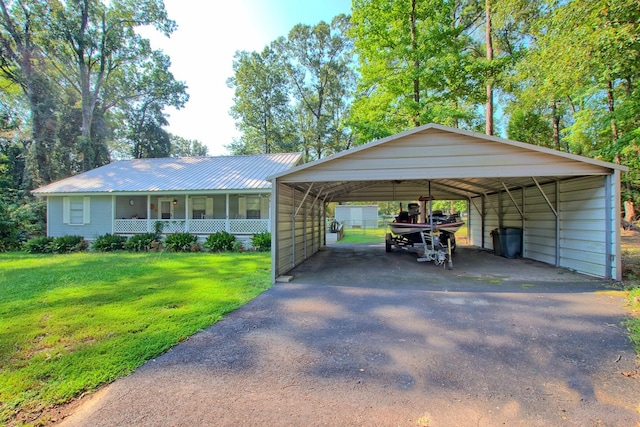 view of parking with a carport and a lawn