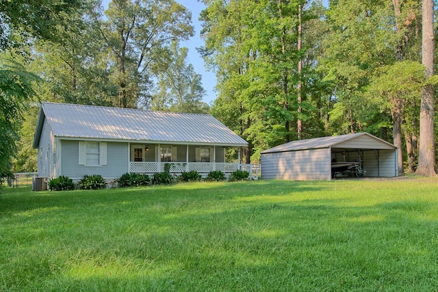 910 Lakeshore Dr, Hemphill, TX 75948 - view of front of property with a detached carport, a front lawn, covered porch, and a metal roof