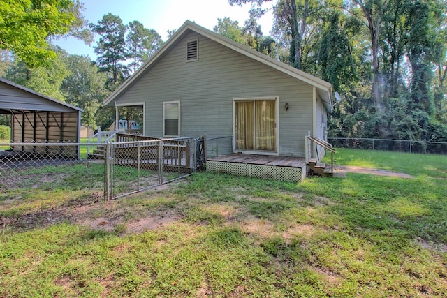 rear view of property with a yard