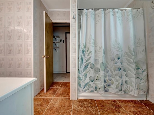 full bath featuring shower / tub combo, wallpapered walls, ornamental molding, and tile patterned floors