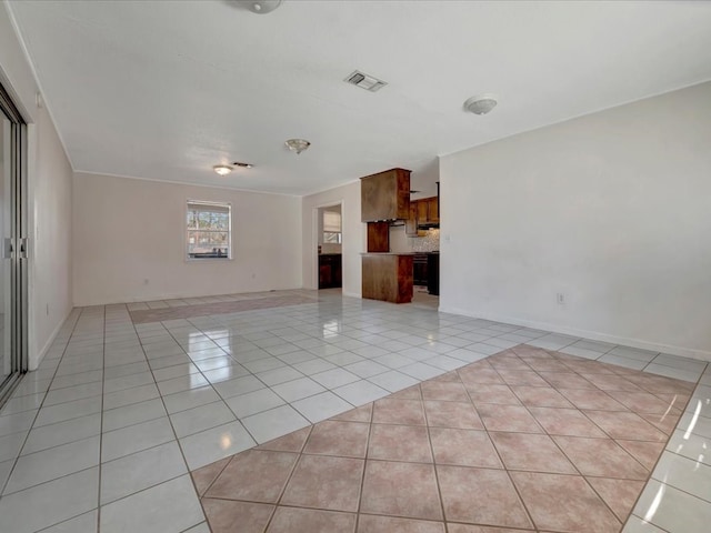 unfurnished living room featuring light tile patterned flooring and visible vents