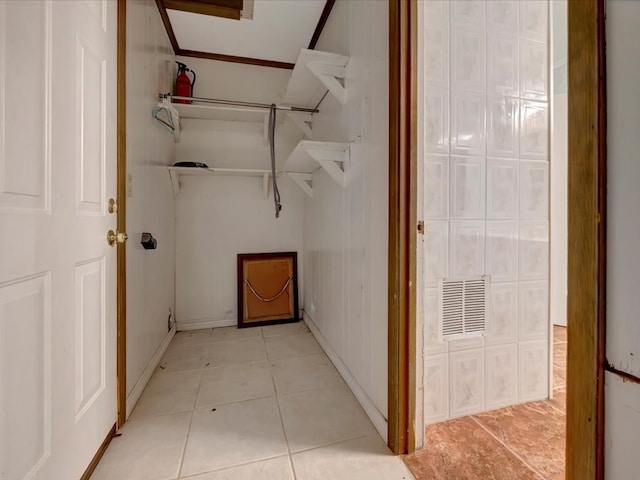 interior space with light tile patterned floors and visible vents