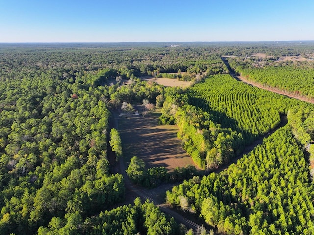 drone / aerial view with a view of trees