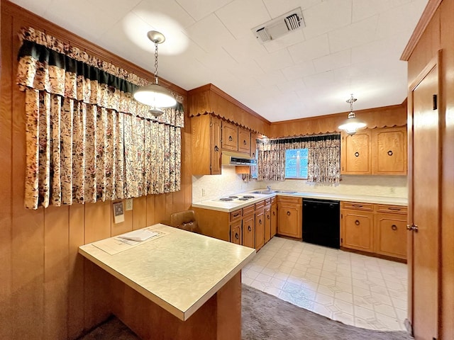 kitchen with white electric stovetop, visible vents, hanging light fixtures, light countertops, and dishwasher