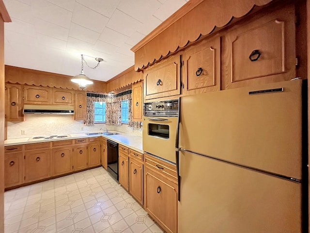 kitchen with wall oven, under cabinet range hood, dishwasher, light countertops, and freestanding refrigerator