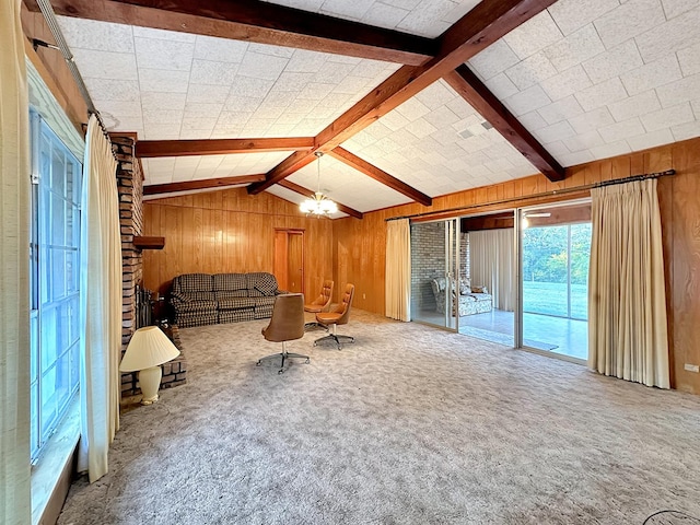 living room featuring carpet floors, wooden walls, a chandelier, and vaulted ceiling with beams