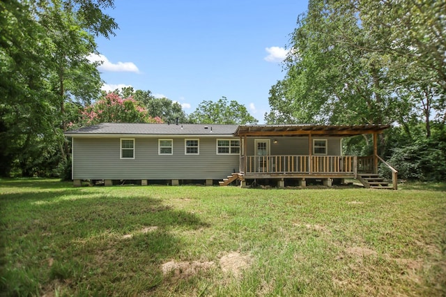 175 Weeks St, Lufkin, TX 75904 - rear view of house featuring a lawn and a wooden deck